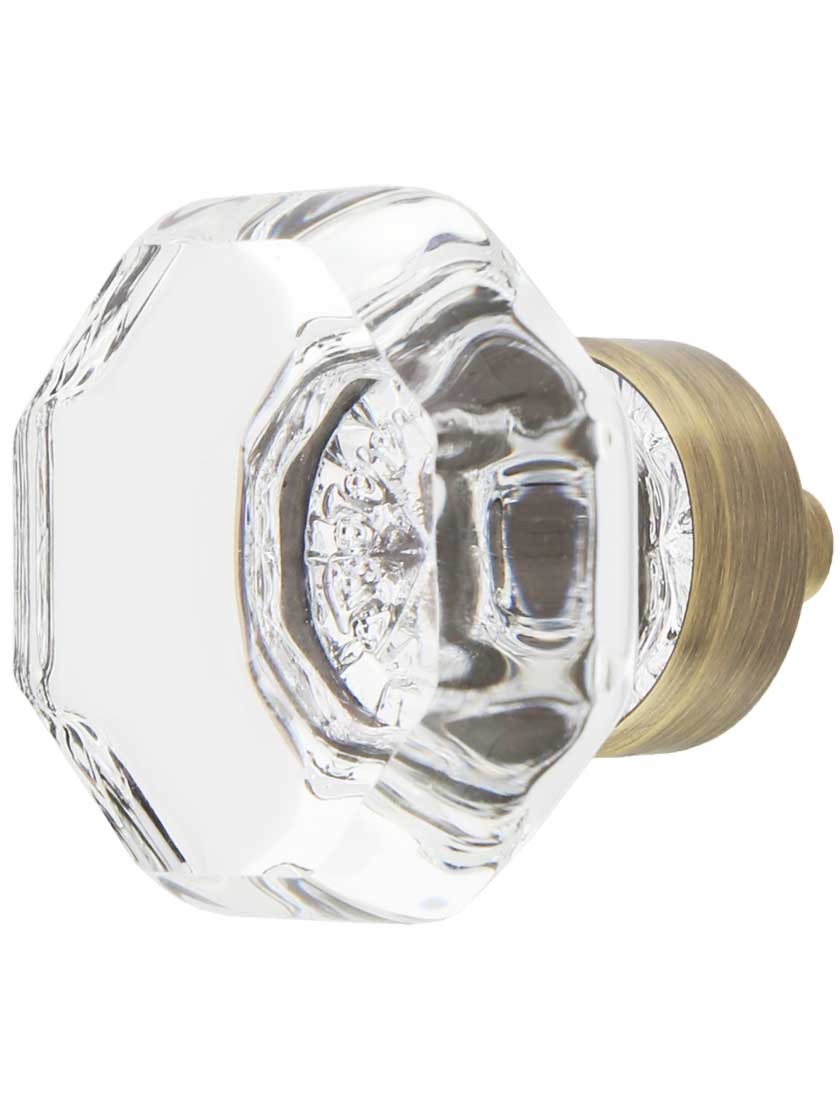 Waldorf Lead-Free Crystal Cabinet Knob 1 3/8 inch Diameter in Antique Brass.